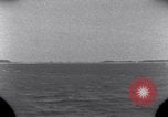 Standbild OS2U Kingfisher scout Wasserflugzeug landet in Wasser Majuro Marshall Inseln, 1944, aus Sekunde 11 historischem Filmmaterial Videoclip 65675028036
