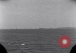 Standbild OS2U Kingfisher scout Wasserflugzeug landet in Wasser Majuro Marshall Inseln, 1944, aus Sekunde 12 historischem Filmmaterial Videoclip 65675028036