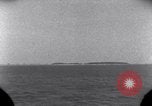Standbild OS2U Kingfisher scout Wasserflugzeug landet in Wasser Majuro Marshall Inseln, 1944, aus Sekunde 14 historischem Filmmaterial Videoclip 65675028036