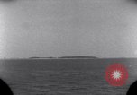 Standbild OS2U Kingfisher scout Wasserflugzeug landet in Wasser Majuro Marshall Inseln, 1944, aus Sekunde 15 historischem Filmmaterial Videoclip 65675028036