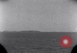 Standbild OS2U Kingfisher scout Wasserflugzeug landet in Wasser Majuro Marshall Inseln, 1944, aus Sekunde 16 historischem Filmmaterial Videoclip 65675028036