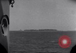 Standbild OS2U Kingfisher scout Wasserflugzeug landet in Wasser Majuro Marshall Inseln, 1944, aus Sekunde 17 historischem Filmmaterial Videoclip 65675028036