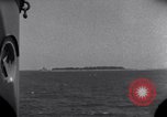 Standbild OS2U Kingfisher scout Wasserflugzeug landet in Wasser Majuro Marshall Inseln, 1944, aus Sekunde 18 historischem Filmmaterial Videoclip 65675028036