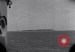 Standbild OS2U Kingfisher scout Wasserflugzeug landet in Wasser Majuro Marshall Inseln, 1944, aus Sekunde 19 historischem Filmmaterial Videoclip 65675028036