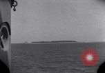 Standbild OS2U Kingfisher scout Wasserflugzeug landet in Wasser Majuro Marshall Inseln, 1944, aus Sekunde 20 historischem Filmmaterial Videoclip 65675028036