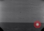 Standbild OS2U Kingfisher scout Wasserflugzeug landet in Wasser Majuro Marshall Inseln, 1944, aus Sekunde 23 historischem Filmmaterial Videoclip 65675028036