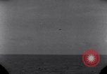 Standbild OS2U Kingfisher scout Wasserflugzeug landet in Wasser Majuro Marshall Inseln, 1944, aus Sekunde 25 historischem Filmmaterial Videoclip 65675028036