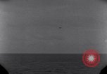 Standbild OS2U Kingfisher scout Wasserflugzeug landet in Wasser Majuro Marshall Inseln, 1944, aus Sekunde 27 historischem Filmmaterial Videoclip 65675028036