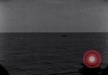 Standbild OS2U Kingfisher scout Wasserflugzeug landet in Wasser Majuro Marshall Inseln, 1944, aus Sekunde 29 historischem Filmmaterial Videoclip 65675028036