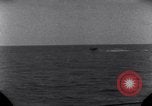 Standbild OS2U Kingfisher scout Wasserflugzeug landet in Wasser Majuro Marshall Inseln, 1944, aus Sekunde 31 historischem Filmmaterial Videoclip 65675028036