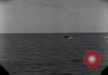 Standbild OS2U Kingfisher scout Wasserflugzeug landet in Wasser Majuro Marshall Inseln, 1944, aus Sekunde 32 historischem Filmmaterial Videoclip 65675028036
