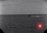 Standbild OS2U Kingfisher scout Wasserflugzeug landet in Wasser Majuro Marshall Inseln, 1944, aus Sekunde 33 historischem Filmmaterial Videoclip 65675028036