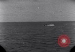 Standbild OS2U Kingfisher scout Wasserflugzeug landet in Wasser Majuro Marshall Inseln, 1944, aus Sekunde 34 historischem Filmmaterial Videoclip 65675028036