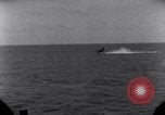 Standbild OS2U Kingfisher scout Wasserflugzeug landet in Wasser Majuro Marshall Inseln, 1944, aus Sekunde 35 historischem Filmmaterial Videoclip 65675028036