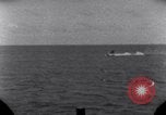 Standbild OS2U Kingfisher scout Wasserflugzeug landet in Wasser Majuro Marshall Inseln, 1944, aus Sekunde 36 historischem Filmmaterial Videoclip 65675028036