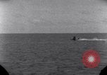 Standbild OS2U Kingfisher scout Wasserflugzeug landet in Wasser Majuro Marshall Inseln, 1944, aus Sekunde 37 historischem Filmmaterial Videoclip 65675028036