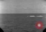 Standbild OS2U Kingfisher scout Wasserflugzeug landet in Wasser Majuro Marshall Inseln, 1944, aus Sekunde 38 historischem Filmmaterial Videoclip 65675028036