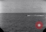 Standbild OS2U Kingfisher scout Wasserflugzeug landet in Wasser Majuro Marshall Inseln, 1944, aus Sekunde 39 historischem Filmmaterial Videoclip 65675028036