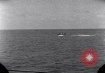 Standbild OS2U Kingfisher scout Wasserflugzeug landet in Wasser Majuro Marshall Inseln, 1944, aus Sekunde 40 historischem Filmmaterial Videoclip 65675028036