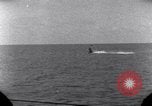 Standbild OS2U Kingfisher scout Wasserflugzeug landet in Wasser Majuro Marshall Inseln, 1944, aus Sekunde 41 historischem Filmmaterial Videoclip 65675028036
