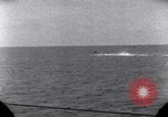 Standbild OS2U Kingfisher scout Wasserflugzeug landet in Wasser Majuro Marshall Inseln, 1944, aus Sekunde 42 historischem Filmmaterial Videoclip 65675028036