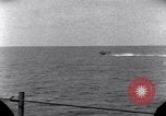 Standbild OS2U Kingfisher scout Wasserflugzeug landet in Wasser Majuro Marshall Inseln, 1944, aus Sekunde 43 historischem Filmmaterial Videoclip 65675028036