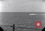 Standbild OS2U Kingfisher scout Wasserflugzeug landet in Wasser Majuro Marshall Inseln, 1944, aus Sekunde 44 historischem Filmmaterial Videoclip 65675028036