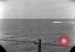 Standbild OS2U Kingfisher scout Wasserflugzeug landet in Wasser Majuro Marshall Inseln, 1944, aus Sekunde 45 historischem Filmmaterial Videoclip 65675028036