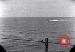 Standbild OS2U Kingfisher scout Wasserflugzeug landet in Wasser Majuro Marshall Inseln, 1944, aus Sekunde 46 historischem Filmmaterial Videoclip 65675028036