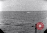 Standbild OS2U Kingfisher scout Wasserflugzeug landet in Wasser Majuro Marshall Inseln, 1944, aus Sekunde 48 historischem Filmmaterial Videoclip 65675028036