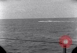 Standbild OS2U Kingfisher scout Wasserflugzeug landet in Wasser Majuro Marshall Inseln, 1944, aus Sekunde 49 historischem Filmmaterial Videoclip 65675028036