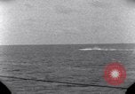 Standbild OS2U Kingfisher scout Wasserflugzeug landet in Wasser Majuro Marshall Inseln, 1944, aus Sekunde 51 historischem Filmmaterial Videoclip 65675028036