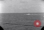 Standbild OS2U Kingfisher scout Wasserflugzeug landet in Wasser Majuro Marshall Inseln, 1944, aus Sekunde 52 historischem Filmmaterial Videoclip 65675028036