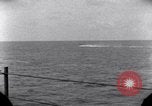 Standbild OS2U Kingfisher scout Wasserflugzeug landet in Wasser Majuro Marshall Inseln, 1944, aus Sekunde 55 historischem Filmmaterial Videoclip 65675028036