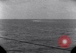 Standbild OS2U Kingfisher scout Wasserflugzeug landet in Wasser Majuro Marshall Inseln, 1944, aus Sekunde 56 historischem Filmmaterial Videoclip 65675028036