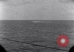 Standbild OS2U Kingfisher scout Wasserflugzeug landet in Wasser Majuro Marshall Inseln, 1944, aus Sekunde 57 historischem Filmmaterial Videoclip 65675028036