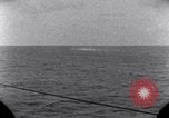 Standbild OS2U Kingfisher scout Wasserflugzeug landet in Wasser Majuro Marshall Inseln, 1944, aus Sekunde 59 historischem Filmmaterial Videoclip 65675028036