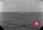 Standbild OS2U Kingfisher scout Wasserflugzeug landet in Wasser Majuro Marshall Inseln, 1944, aus Sekunde 60 historischem Filmmaterial Videoclip 65675028036