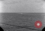Standbild OS2U Kingfisher scout Wasserflugzeug landet in Wasser Majuro Marshall Inseln, 1944, aus Sekunde 61 historischem Filmmaterial Videoclip 65675028036