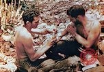 Image of Marine renders first aid to wounded buddy Saipan Northern Mariana Islands, 1944, second 12 stock footage video 65675028048