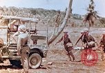 Image of Evacuating a wounded U.S. marine Saipan Northern Mariana Islands, 1944, second 8 stock footage video 65675028049