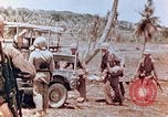 Image of Evacuating a wounded U.S. marine Saipan Northern Mariana Islands, 1944, second 10 stock footage video 65675028049