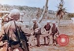 Image of Evacuating a wounded U.S. marine Saipan Northern Mariana Islands, 1944, second 11 stock footage video 65675028049