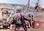 Image of Evacuating a wounded U.S. marine Saipan Northern Mariana Islands, 1944, second 12 stock footage video 65675028049