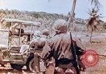 Image of Evacuating a wounded U.S. marine Saipan Northern Mariana Islands, 1944, second 13 stock footage video 65675028049
