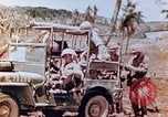 Image of Evacuating a wounded U.S. marine Saipan Northern Mariana Islands, 1944, second 17 stock footage video 65675028049