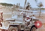 Image of Evacuating a wounded U.S. marine Saipan Northern Mariana Islands, 1944, second 28 stock footage video 65675028049