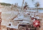 Image of Evacuating a wounded U.S. marine Saipan Northern Mariana Islands, 1944, second 30 stock footage video 65675028049