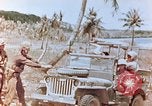 Image of Evacuating a wounded U.S. marine Saipan Northern Mariana Islands, 1944, second 32 stock footage video 65675028049