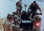 Image of U.S. marines set up camouflaged artillery  Saipan Northern Mariana Islands, 1944, second 1 stock footage video 65675028054
